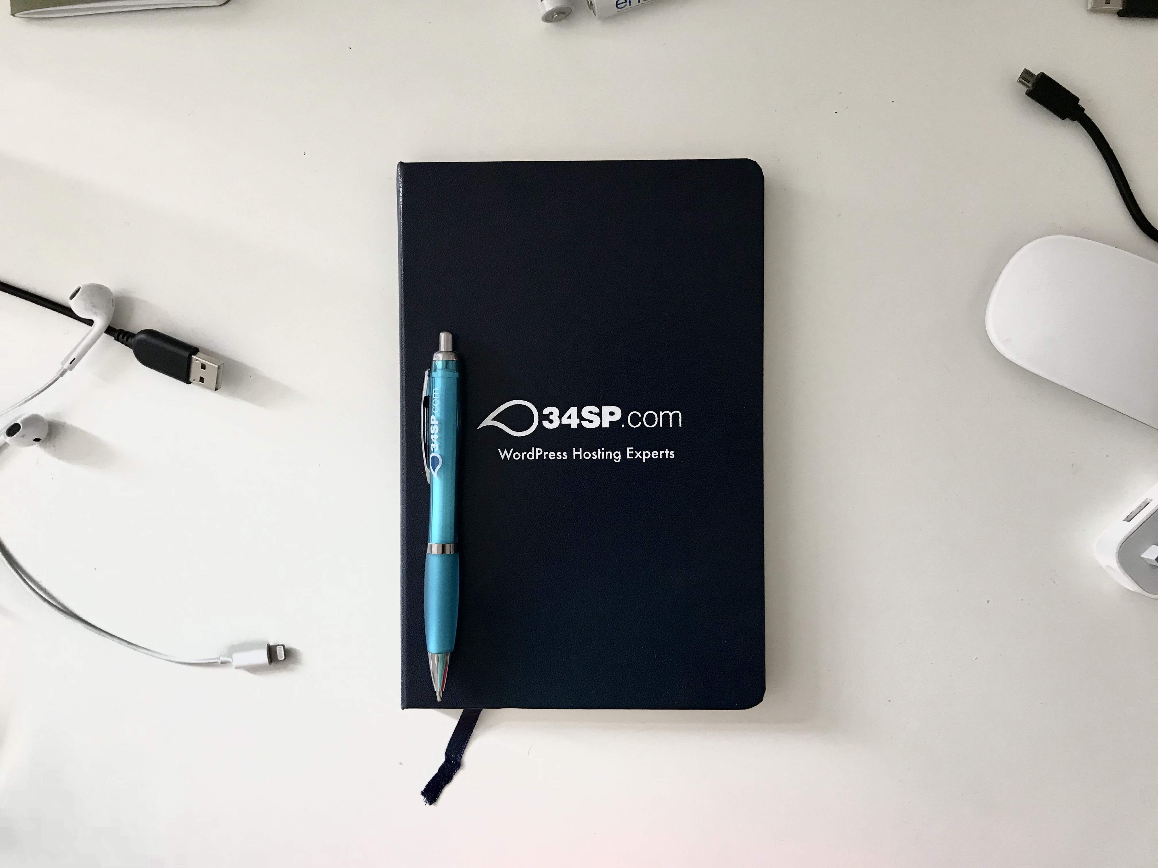 34SP.com notebook and pen